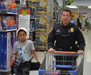 Cape Coral police chief Dave Newlan shops with a student during a previous Shop with a Cop event
